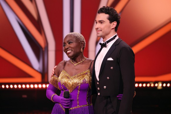 COLOGNE, GERMANY - MAY 14: Auma Obama and Andrzej Cibis talk to the jury after their performance during the 10th show of the 14th season of the television competition &quot;Let's Dance&quot; on May 14 ...