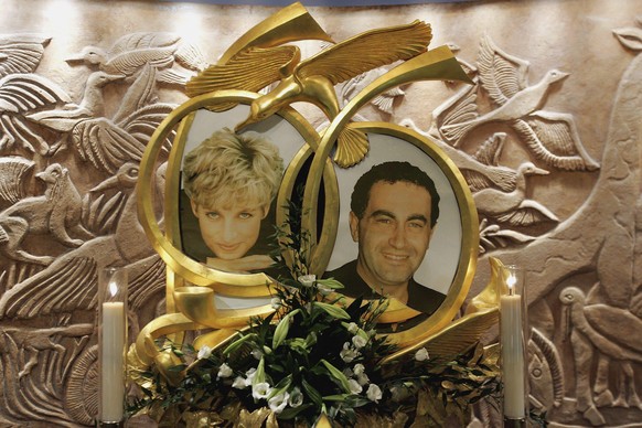 LONDON - JANUARY 08: Candles burn beside The Diana, Princess of Wales and Dodi Fayed memorial in Harrods on January 8, 2006 in London, England. An inquest into the deaths of Diana, Princess of Wales,  ...