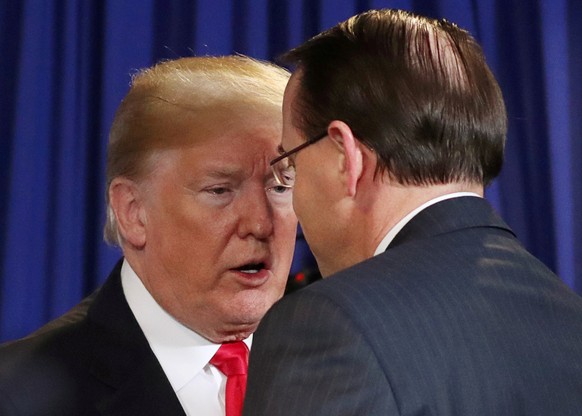 FILE PHOTO: U.S. President Donald Trump shakes hands with Deputy Attorney General Rod Rosenstein at the conclusion of a roundtable on immigration and the gang MS-13 at the Morrelly Homeland Security C ...