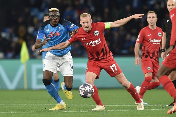 Victor Osimhen of SSC Napoli competes for the ball with Sebastian Rode of Eintracht Frankfurt during the Uefa Champions League match between SSC Napoli v Eintracht Frankfurt at Diego Armando Maradona  ...