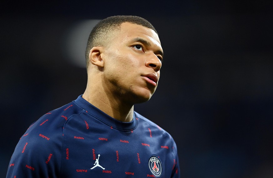 MADRID, SPAIN - MARCH 09: Kylian Mbappe of Paris Saint-Germain looks on during his warm up prior to the UEFA Champions League Round Of Sixteen Leg Two match between Real Madrid and Paris Saint-Germain ...