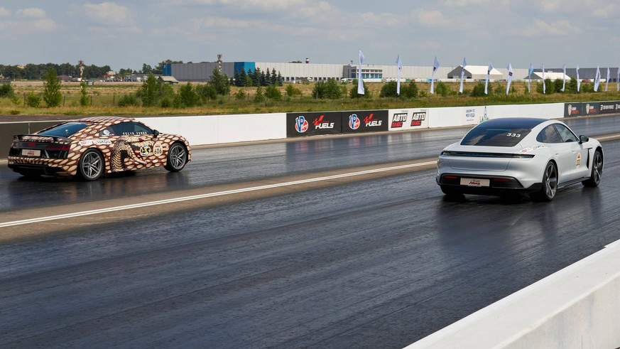 July 18, 2021, Bykovo, Russia: Tesla overtakes Audi R8 during the Moscow Mile supercars race..The Moscow Mile supercars festival, organized by the Moscow Government and the DSC OFF Youtube channel, wi ...