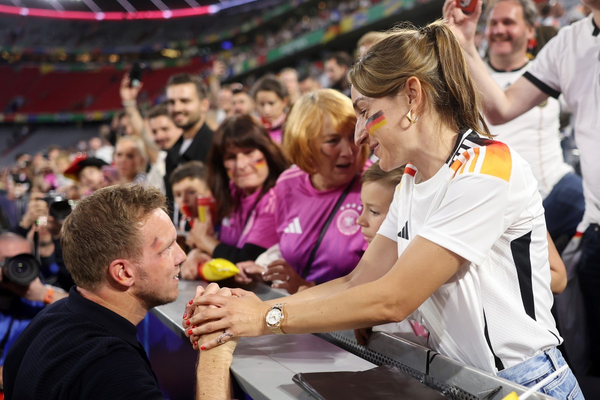 MUNICH, GERMANY - JUNE 14: Julian Nagelsmann, Head Coach of Germany, celebrates victory with his Partner Lena Wurzenberger after defeating Scotland during the UEFA EURO 2024 group stage match between  ...