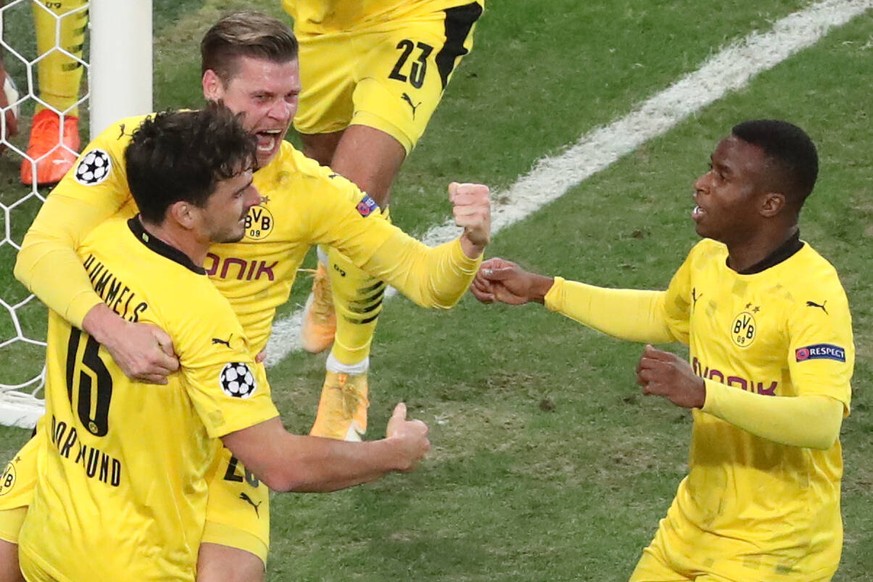 ST PETERSBURG, RUSSIA - DECEMBER 8, 2020: Dortmund s Mats Hummels, Lukasz Piszczek, and Youssoufa Moukoko L-R celebrate after scoring in the 2020/21 UEFA Champions League Group F Round 6 football matc ...