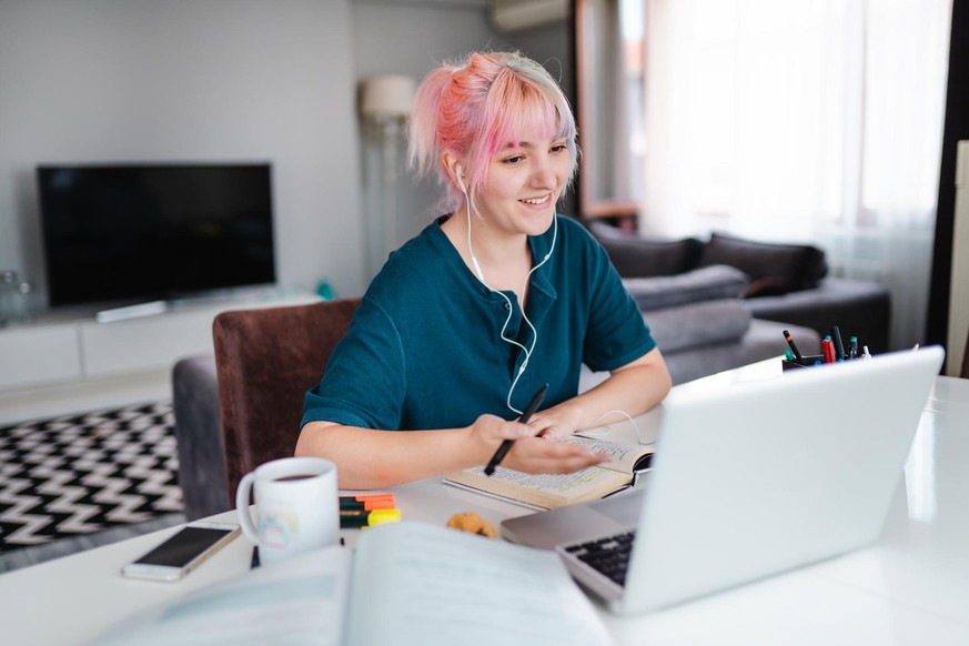 Young women studying at home during pandemic isolation