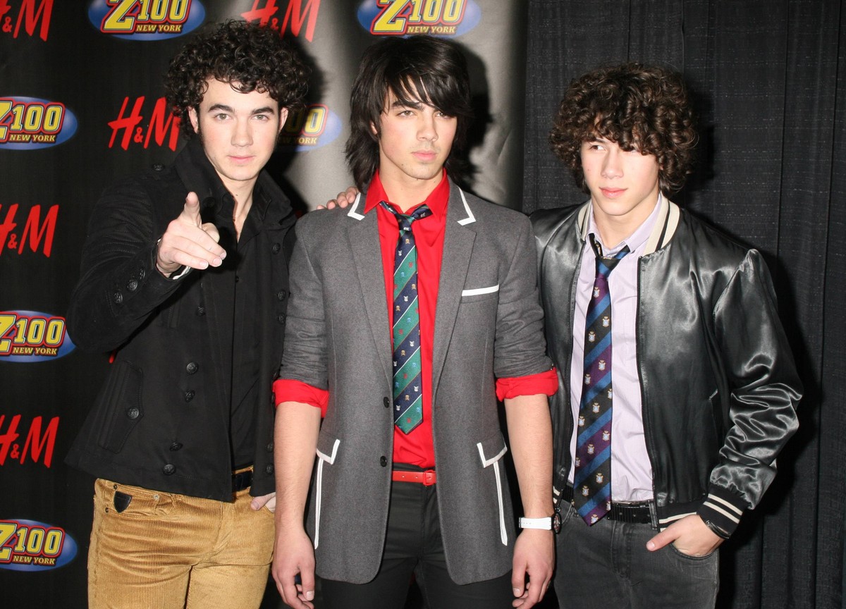 Dec 14, 2007 - New York, NY, USA - NICK JONAS, JOE JONAS and KEVIN JONAS of the JONAS BROTHERS poses for photos in the press room for Z100 s Jingle Ball 2007 held at Madison Square Garden. PUBLICATION ...
