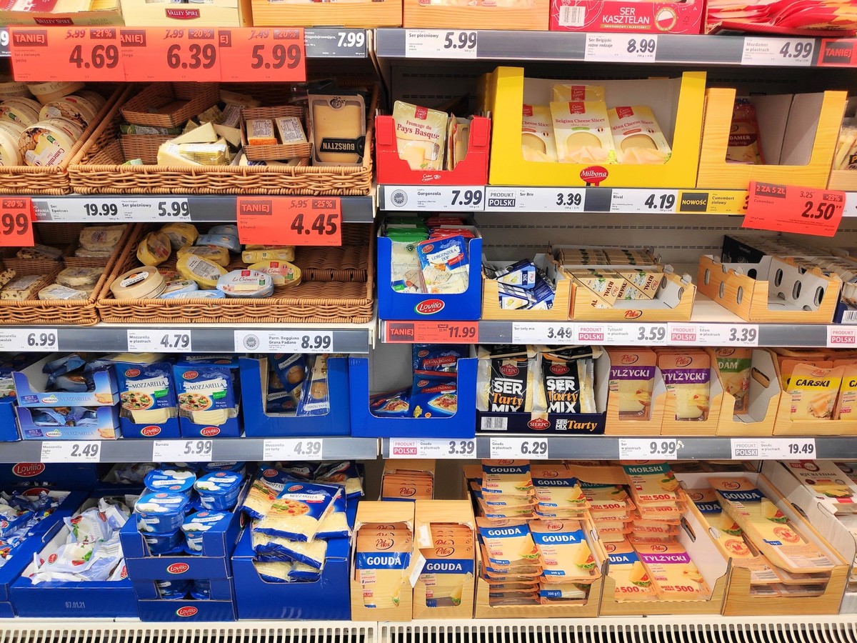 Cheese promo in a supermarket, BYTOM, POLAND - DECEMBER 31, 2020: Cheese promo prices in a Lidl supermarket in Bytom, Poland. Lidl is present in 29 European countries, with more than 630 locations in ...