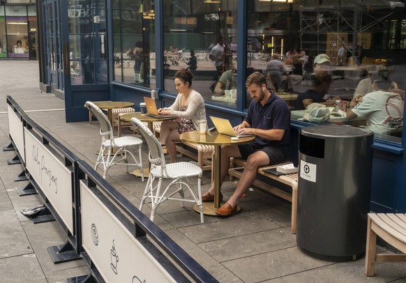 Working on your laptop at Daiily Provisions Customers take advantage of free wi-fi outside of Danny Meyers Daily Provisions restaurant chain in the Manhattan West development in New York on Monday, Ju ...