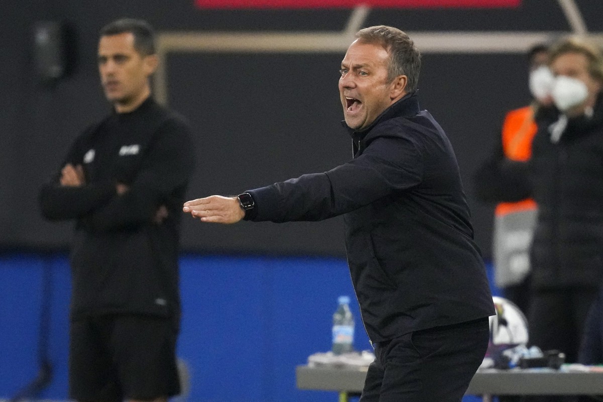 FILE - Germany's head coach Hansi Flick reacts during the World Cup 2022 group J qualifying soccer match between Germany and Romania in Hamburg, Germany, on Oct. 8, 2021. Flick has hinted at his ...