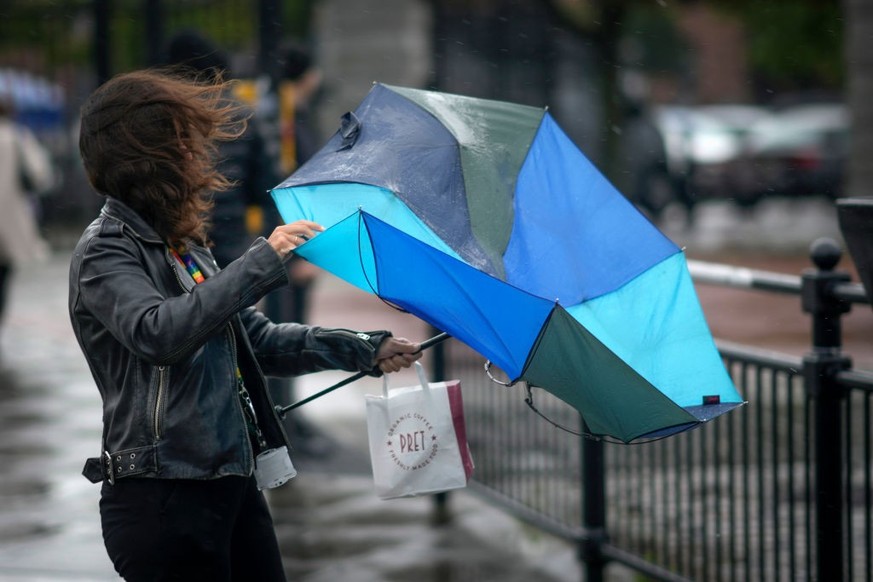 LIVERPOOL, UNITED KINGDOM- SEPTEMBER 27: People brave the first rain and wind of Storm Agnes as it approaches the UK on September 27, 2023 in Liverpool, United Kingdom. (Photo by Christopher Furlong/G ...