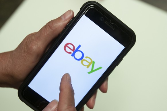 FILE - An eBay app is shown on a mobile phone, July 11, 2019, in Miami. On Wednesday, Sept. 27, 2023, the U.S. Justice Department filed a civil complaint against eBay, claiming the online company unla ...