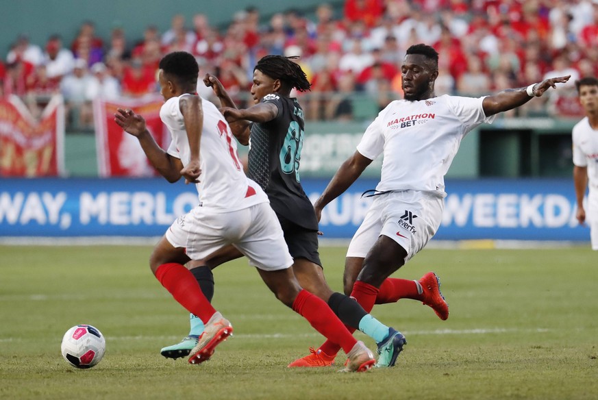 BOSTON, MA - JULY 21: Sevilla FC defender Joris Gnagnon (24) takes out Liverpool FC defender Yasser Larouci (65) during a club friendly between Liverpool FC and Sevilla FC on July 21, 2019, at Fenway  ...