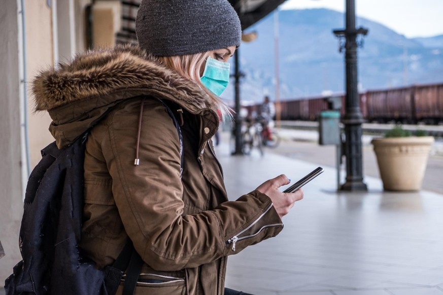 Caucasian Woman waring Face Mask on the Station; Slovenia on the border with Italy, Europe.