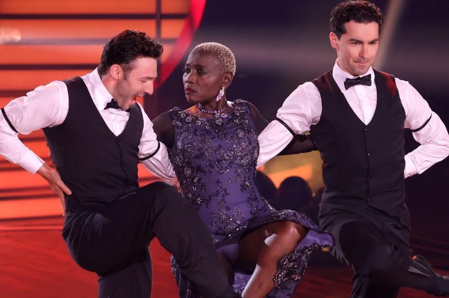 COLOGNE, GERMANY - MAY 14: Auma Obama (C), Robert Beitsch (L) and Andrzej Cibis (R) perform on stage during the 10th show of the 14th season of the television competition &quot;Let&#039;s Dance&quot;  ...