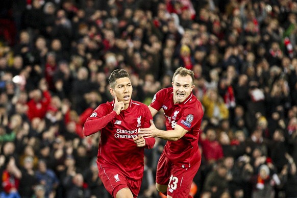 October 24, 2018 - Liverpool, England, United Kingdom - Liverpool forward Roberto Firmino (9) celebrates with Liverpool midfielder Xherdan Shaqiri (23) after scoring his goal during the Uefa Champions ...