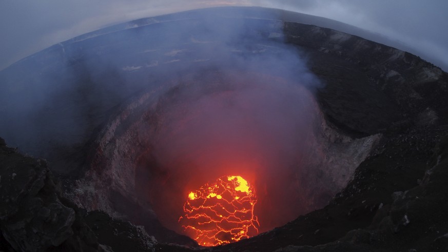 This May 6, 2018 photo provided by the U.S. Geological Survey shows the lava lake at the summit near Pahoa, Hawaii. Hawaii&#039;s erupting Kilauea volcano has destroyed homes and forced the evacuation ...