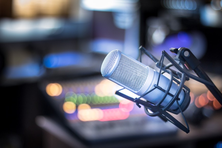 Professional studio microphone, recording studio, equipment in the blurry background
