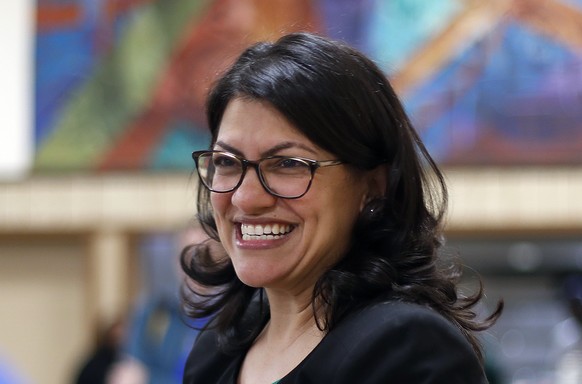 FILE - In this Oct. 26, 2018 file photo, Rashida Tlaib, Democratic candidate for the Michigan&#039;s 13th Congressional District, smiles during a rally in Dearborn, Mich. (AP Photo/Paul Sancya, File)