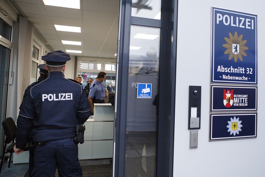 BERLIN, GERMANY - DECEMBER 15: Police enter a new police station shortly after the inauguration at Alexanderplatz on December 15, 2017 in Berlin, Germany. Alexanderplatz, at the heart of Berlin, has s ...