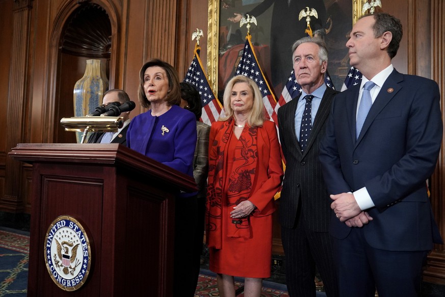 Speaker Nancy Pelosi D-Calif. addresses reporters during a press conference on Tuesday, December 10, 2019 to announce that the House will introduce two articles of impeachment against President Trump  ...