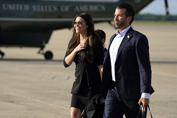 FILE - In this May 27, 2020, file photo, Donald Trump Jr., walks with his girlfriend Kimberly Guilfoyle after arriving at Andrews Air Force Base, Md., after traveling to Florida, with President Donald ...