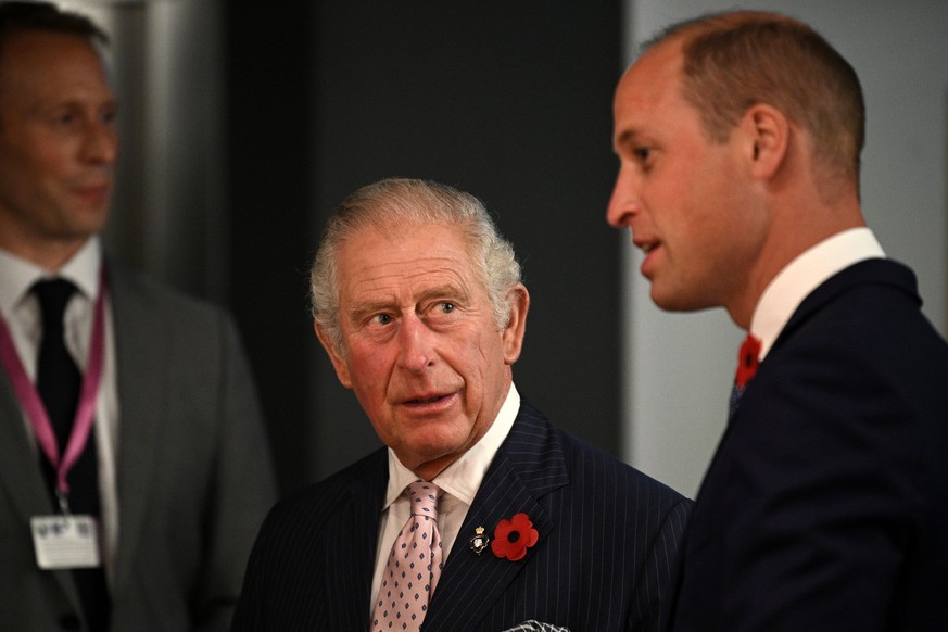 GLASGOW, SCOTLAND - NOVEMBER 01: Prince Charles, Prince of Wales (C) reacts as he speaks with Prince William, Duke of Cambridge (R) at a reception for the key members of the Sustainable Markets Initia ...