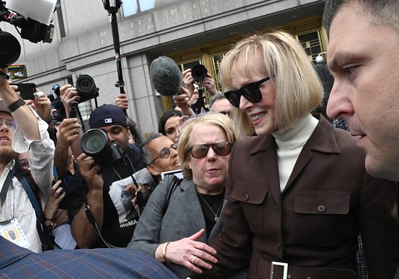E. Jean Carroll exits Manhattan federal court with her attorney Roberta Kaplan on Tuesday May 9, 2023 in New York. The jury found former president Donald Trump guilty of sexual assault and of defaming ...