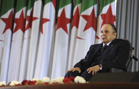 FILE - In this April 28, 2014 file photo, Algerian President Abdelaziz Bouteflika sits on a wheelchair after taking the oath as President, in Algiers. Algeria&#039;s longtime leader Bouteflika has aba ...