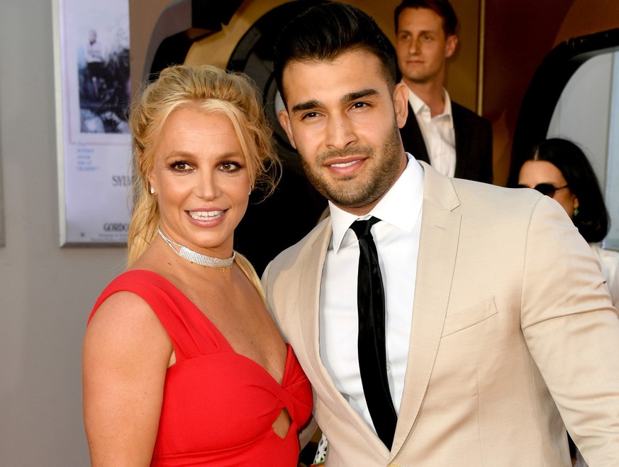 HOLLYWOOD, CALIFORNIA - JULY 22: Britney Spears (L) and Sam Asghari arrive at the premiere of Sony Pictures&#039; &quot;One Upon A Time...In Hollywood&quot; at the Chinese Theatre on July 22, 2019 in  ...