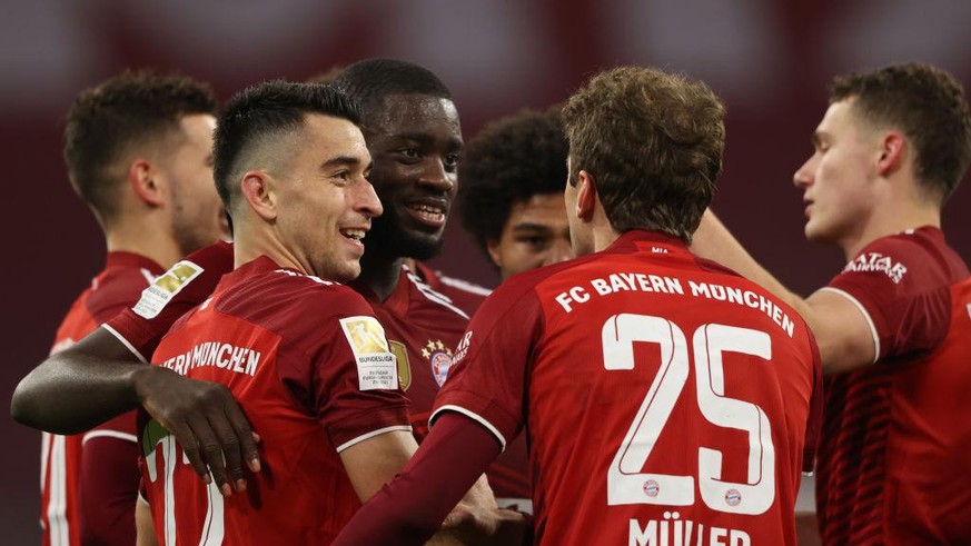 MUNICH, GERMANY - DECEMBER 17: Dayot Upamecano of Muenchen celebrates his team&#039;s second goal with teammates during the Bundesliga match between FC Bayern München and VfL Wolfsburg at Allianz Aren ...