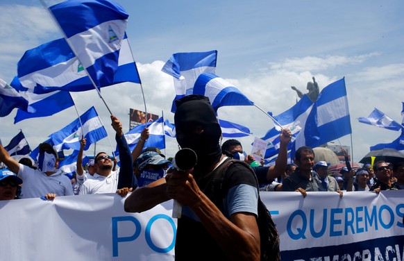 A demonstrator holds a homemade mortar during a march called &quot;Together we are a volcano&quot; against Nicaragua&#039;s President Daniel Ortega&#039;s government, in Managua, Nicaragua July 12, 20 ...