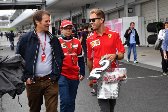 2018 Japanese GP SUZUKA, JAPAN - OCTOBER 04: Sebastian Vettel, Ferrari and Michael Schmidt, Journalist during the Japanese GP at Suzuka on October 04, 2018 in Suzuka, Japan. (Photo by Jerry Andre / Su ...