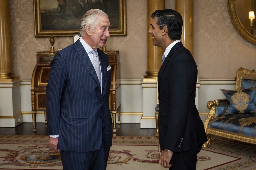 King Charles III welcomes Rishi Sunak during an audience at Buckingham Palace, London, where he invited the newly elected leader of the Conservative Party to become Prime Minister and form a new gover ...