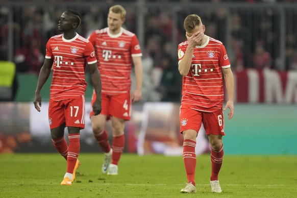 Bayern&#039;s Joshua Kimmich, right, Sadio Mane, left, and Matthijs de Ligt walk along the pitch at the end of the Germany Cup quarter final match between Bayern Munich and SC Freiburg at the Allianz  ...
