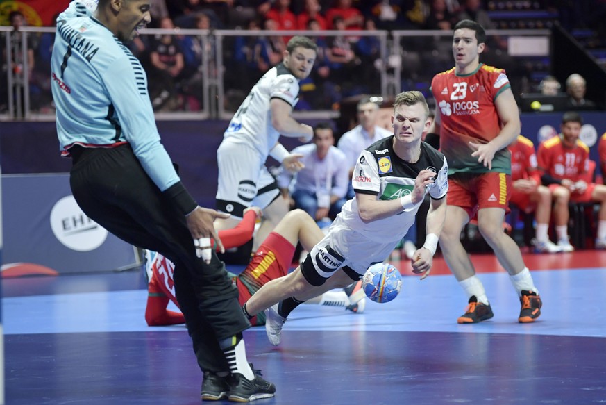 Germany s Timo Kastening in action against Portugal s goal keeper Alfredo Quintana during the match for fifth/sixth place between Germany and Portugal during the Men s European Handball Championship i ...