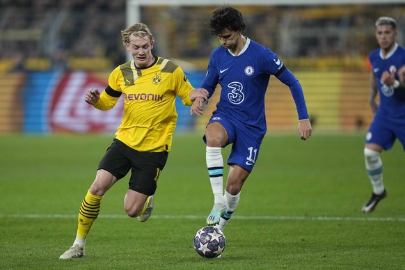 Chelsea&#039;s Joao Felix, right, challenges for the ball with Dortmund&#039;s Julian Brandt during the Champions League, round of 16, first leg soccer match between Borussia Dortmund and Chelsea FC i ...