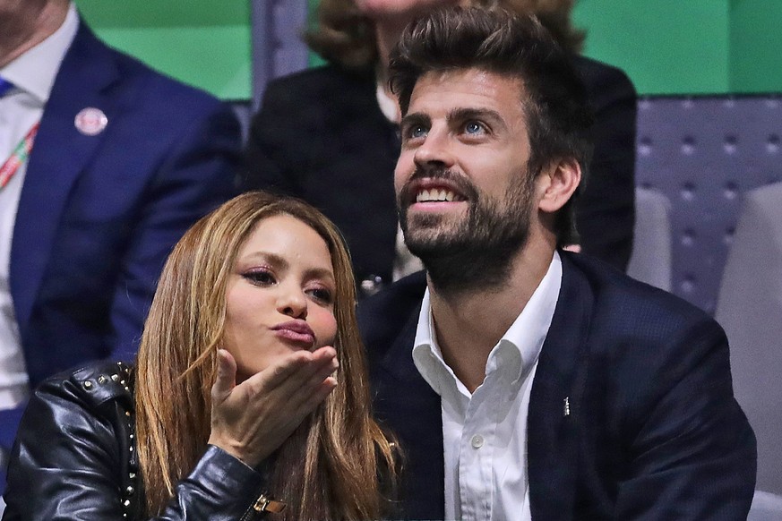 FILE - Colombian singer Shakira blows a kiss next to her husband Barcelona soccer player Gerard Pique while watching the Davis Cup final in Madrid, Spain, on Nov. 24, 2019. Colombian pop star Shakira  ...