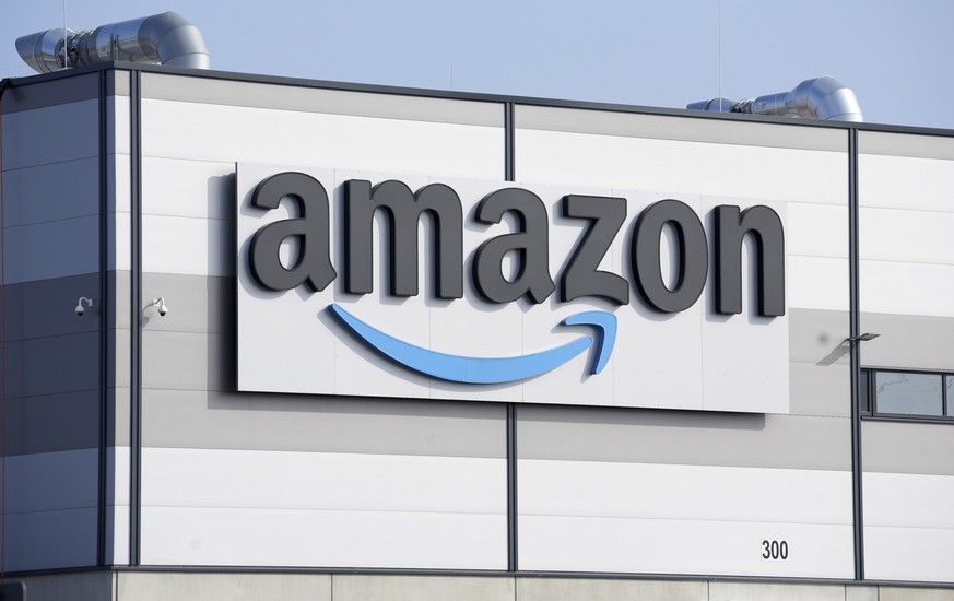 FILE - An Amazon company logo marks the facade of a building in Schoenefeld near Berlin, March 18, 2022. Amazon will impose new fees on third-party sellers who ship their products to customers instead ...