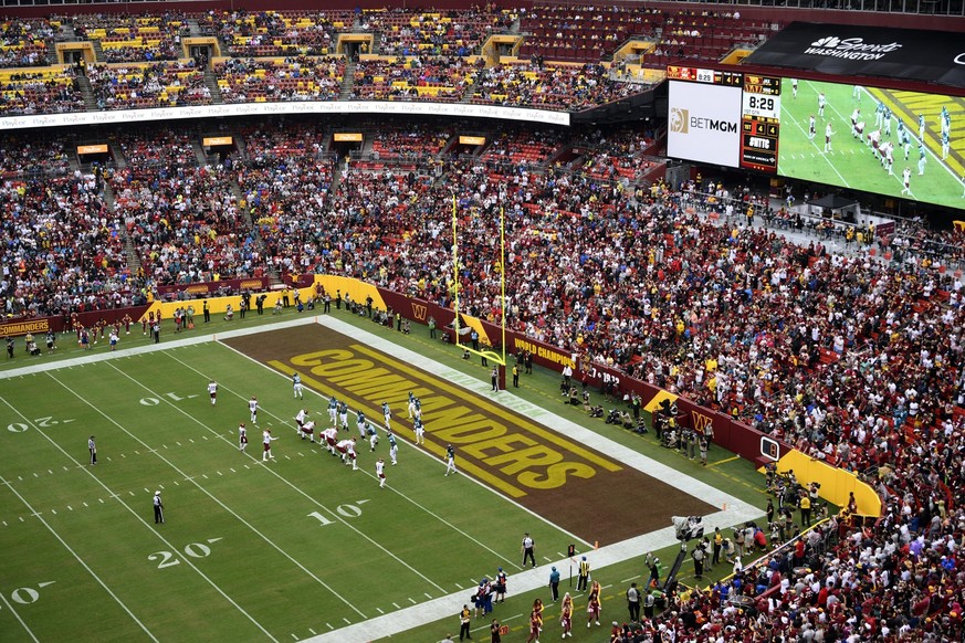 FILE - Fans watch as the Washington Commanders face the Jacksonville Jaguars in an NFL football game, Sunday, Sept. 11, 2022, in Landover, Md. A group led by Josh Harris and Mitchell Rales that includ ...