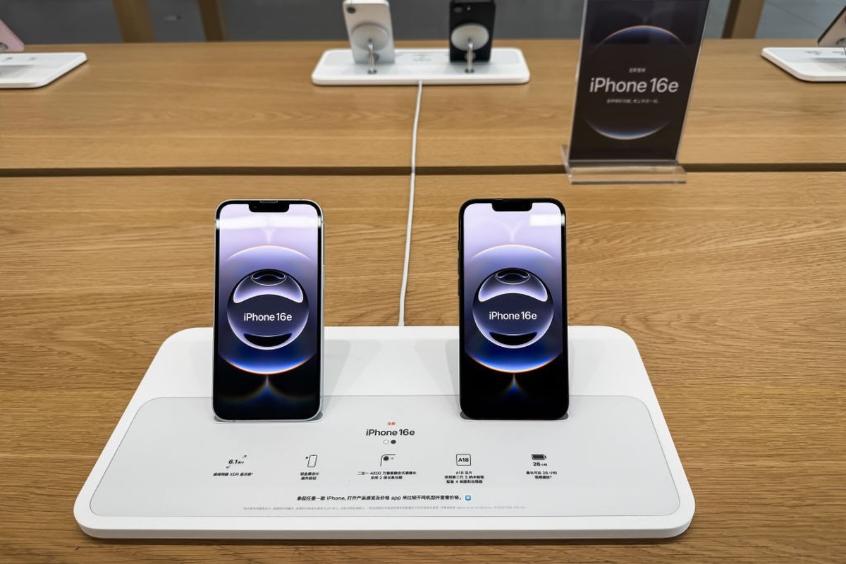 CHONGQING, CHINA - MARCH 1: The newly released iPhone 16e models are displayed on a demo stand inside an Apple Store at Chongqing MixC, showcasing their sleek design and features as part of Apple' ...