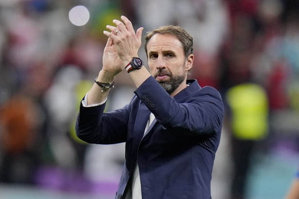 England's head coach Gareth Southgate applauds at the end of the World Cup round of 16 soccer match between England and Senegal, at the Al Bayt Stadium in Al Khor, Qatar, Sunday, Dec. 4, 2022. (AP Pho ...