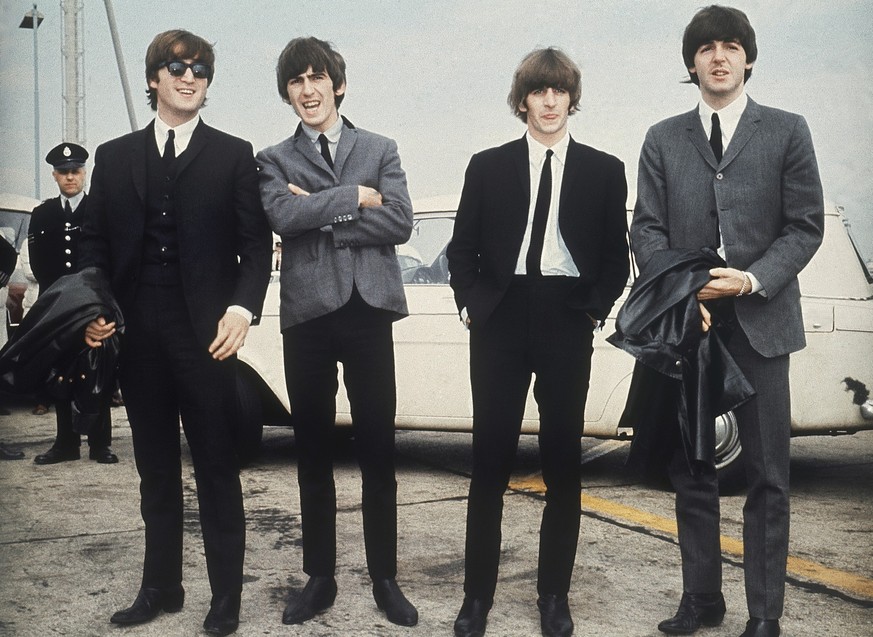 FILE - The Beatles, from left, John Lennon, George Harrison, Ringo Starr and Paul McCartney arrive in Liverpool, England on July 10, 1964, for the premiere of their movie &quot;A Hard Day&#039;s Night ...