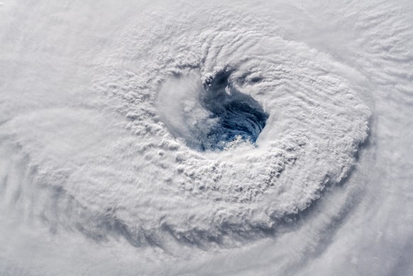 In this Sept. 12, 2018 photo provided by NASA, Hurricane Florence churns over the Atlantic Ocean heading for the U.S. east coast as seen from the International Space Station. Astronaut Alexander Gerst ...