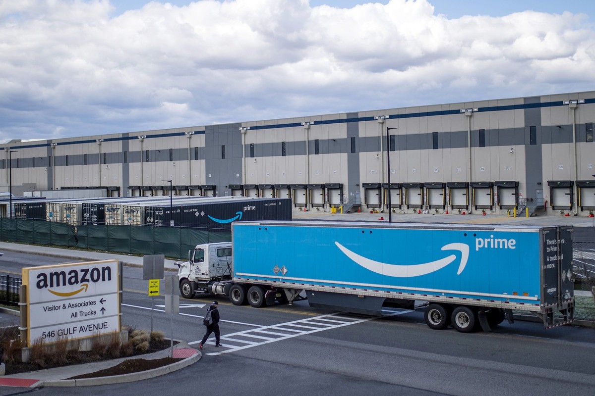 FILE - A truck arrives at the Amazon warehouse facility, in the Staten Island borough of New York, April 1, 2022. Amazon will hire 150,000 full-time, part-time and seasonal employees across its wareho ...