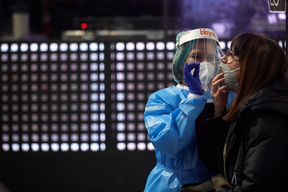 Health workers make coronavirus test to the 5,000 people who will attend to a Love of Lesbian concert at Palau Sant Jordi in Barcelona, Spain on 27 March 2021. The concert is a kind of test to the ass ...
