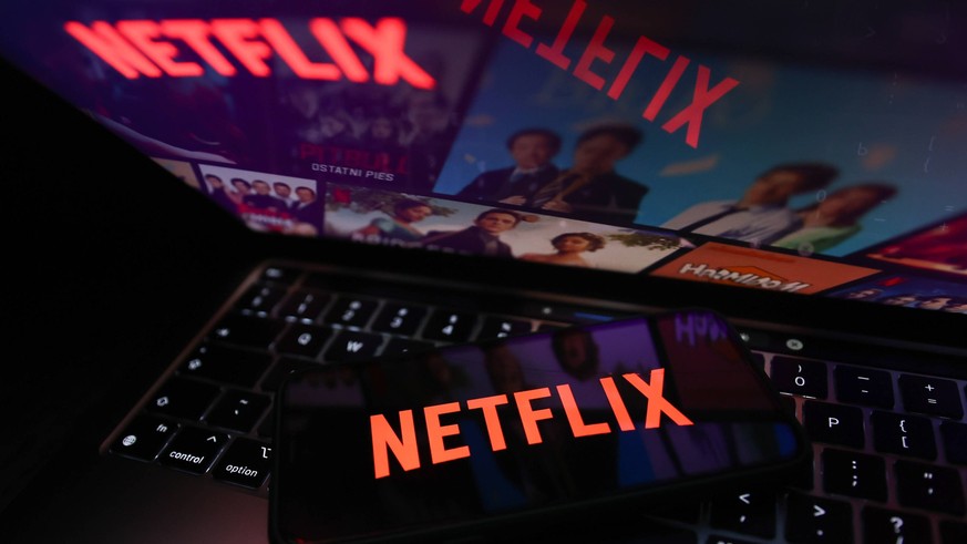 Netflix And Microsoft Photo Illustrations Netflix logo displayed on a phone screen and Netflix website displayed on a laptop screen are seen in this illustration photo taken in Krakow, Poland on July  ...