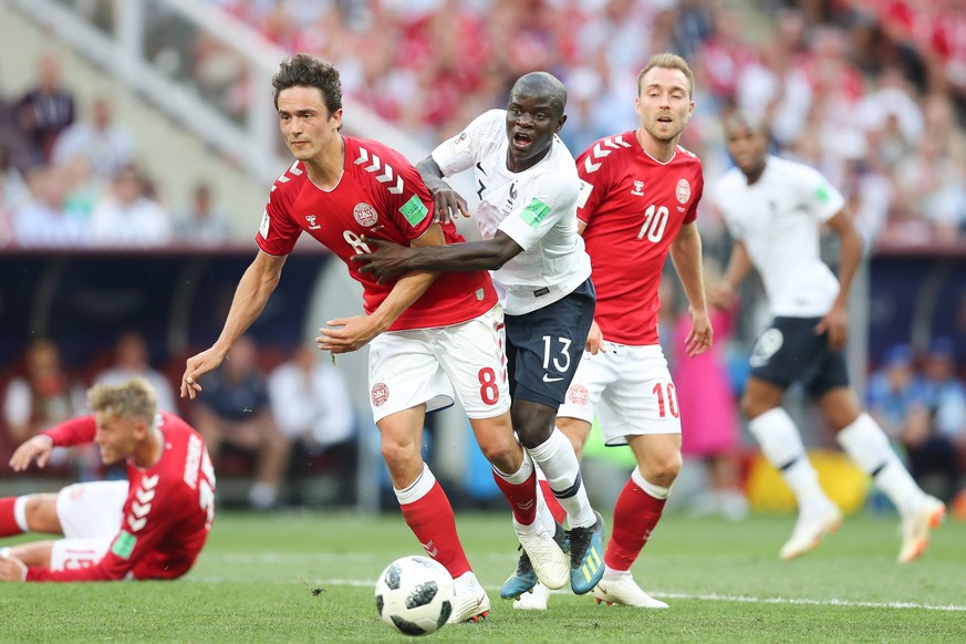 Denmark s Thomas Delaney, France s N Golo Kante and Denmark s Christian Eriksen fight for the ball during the soccer game between France and Denmark, the third game in group C at the 2018 FIFA World C ...