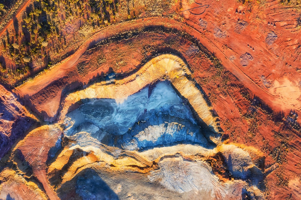 Colourful top down aerial view over open pit mine in Cobar copper town of Outback Australia.