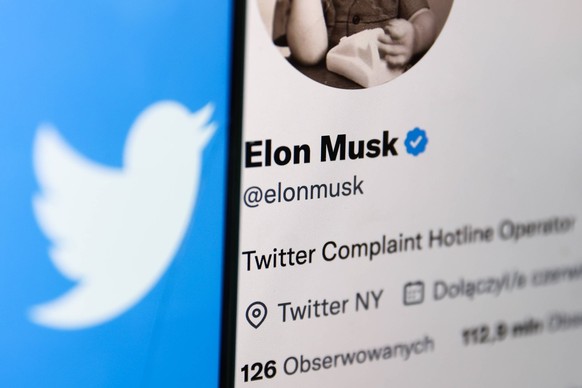 Elon Musk Twitter Complaint Hotline Operator Photo Illustrations Twitter logo displayed on a phone screen and Elon Musk s Twitter account displayed on a laptop screen are seen in this illustration pho ...