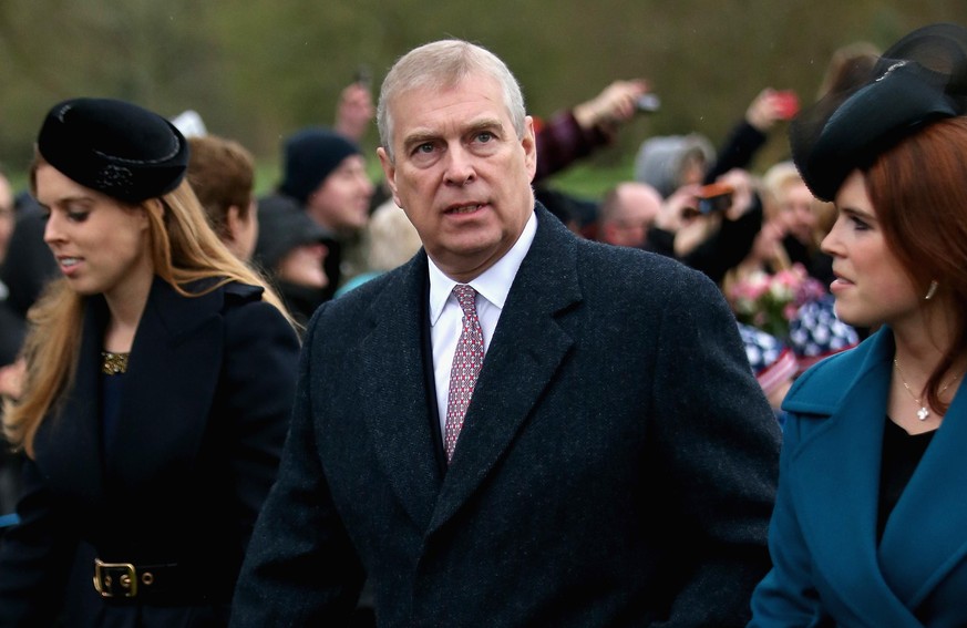 KING&#039;S LYNN, ENGLAND - DECEMBER 25: Prince Andrew, Duke of York and his daughter&#039;s Princess Beatrice and Princess Eugenie attends a Christmas Day church service at Sandringham on December 25 ...